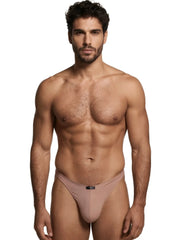 Xtremen tan microfiber bikini brief with a centered black logo patch on the waistband.