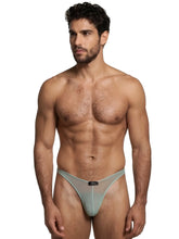 Sage green Xtremen bikini brief in sheer mesh fabric with a centered black brand logo tag.