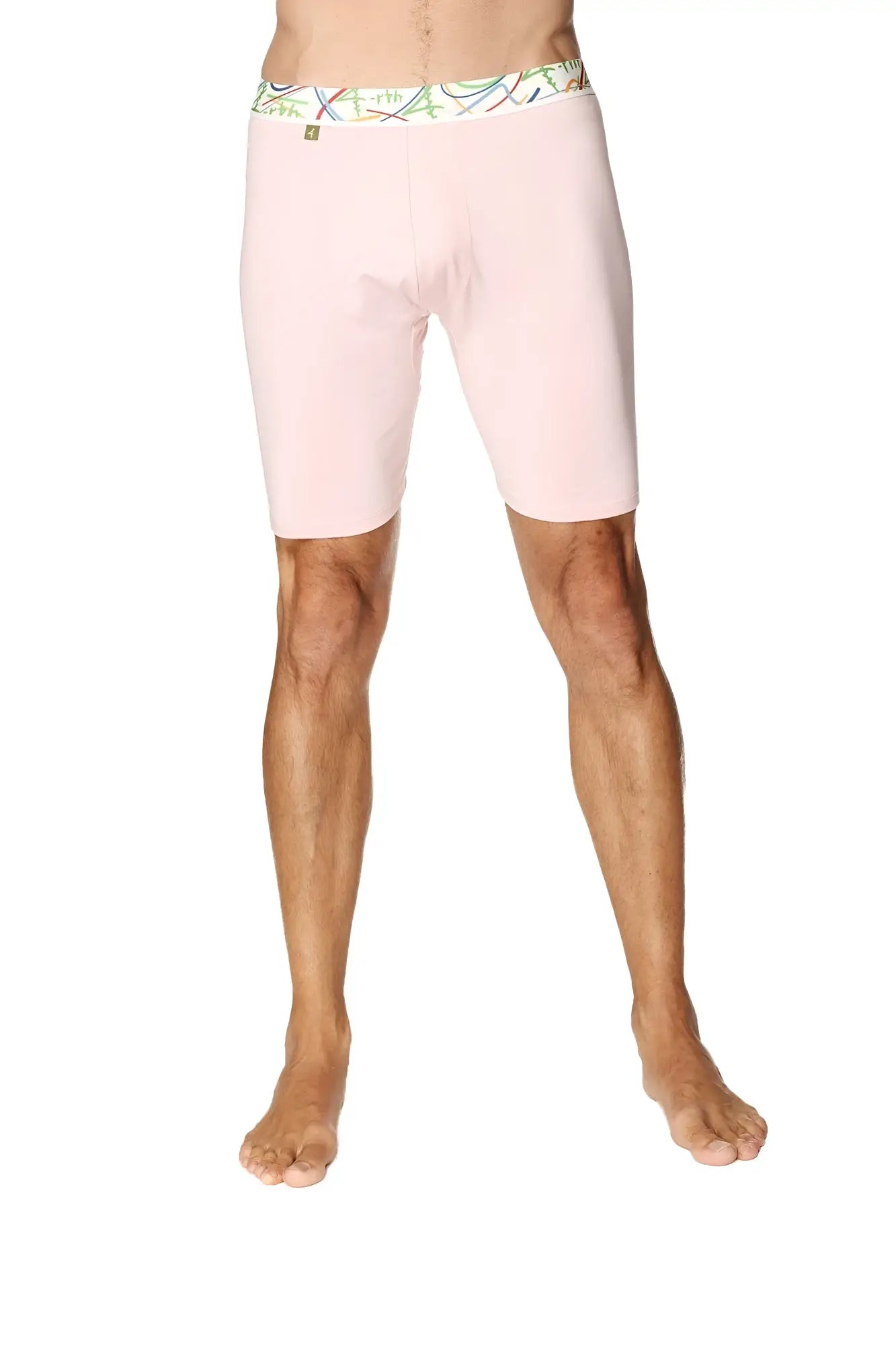 Pink men’s yoga compression shorts with colorful patterned waistband designed for support and flexibility