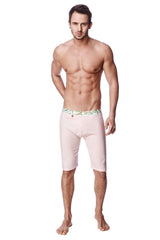 Light pink form-fitting yoga compression shorts with decorative green and white patterned waistband for men