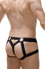 Black harness-style jockstring briefs with circular metal rings at the waistband from petitq beast 2023 collection