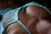 Woman wearing blue lingerie — fabric and fit guide