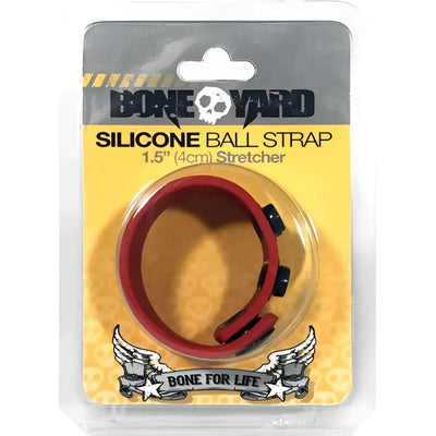 A red silicone strap with black snap fasteners in clear plastic packaging.
