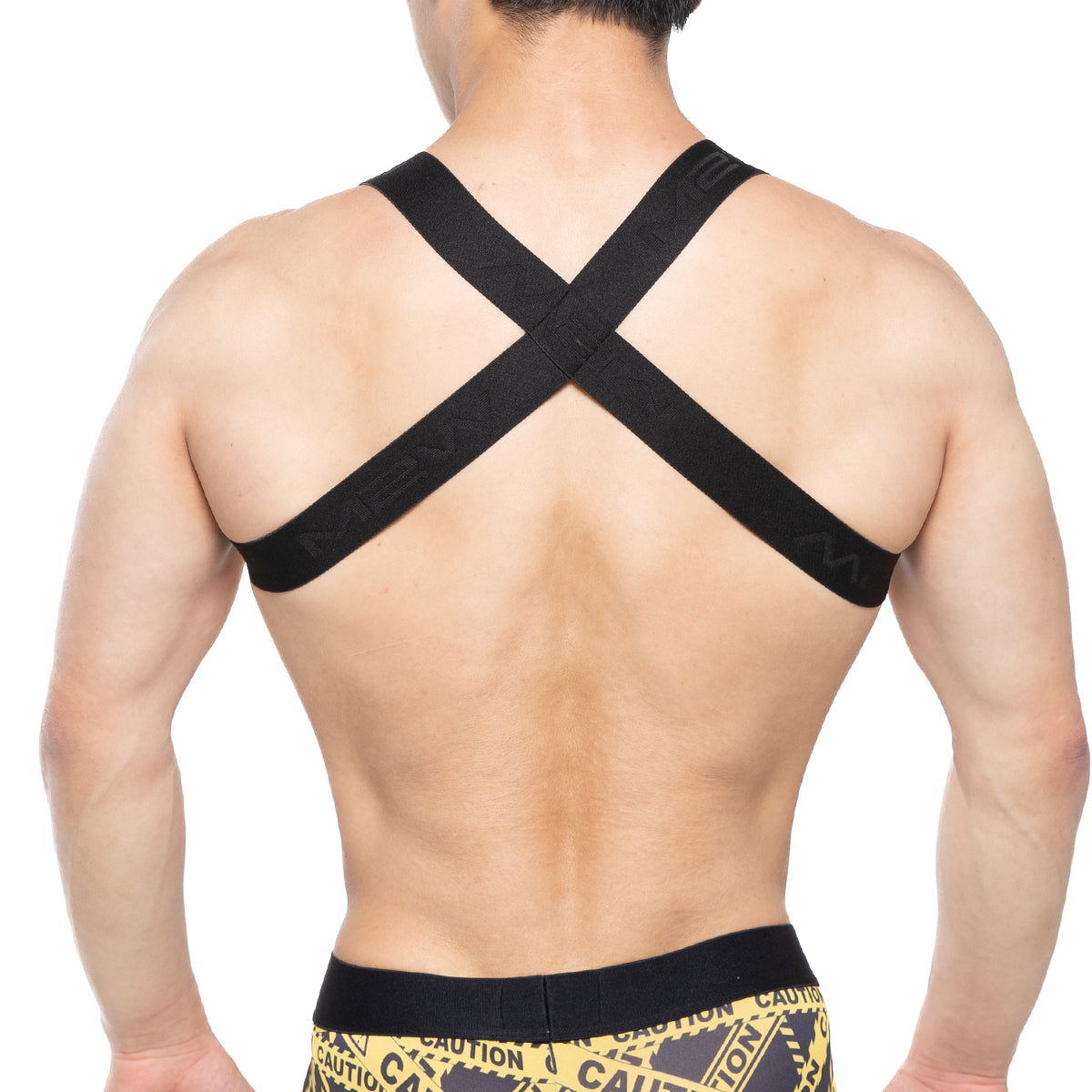 Black cross-back athletic support strap with subtle embossed branding shown from the back metroMalewear brutal harness black 1400-20