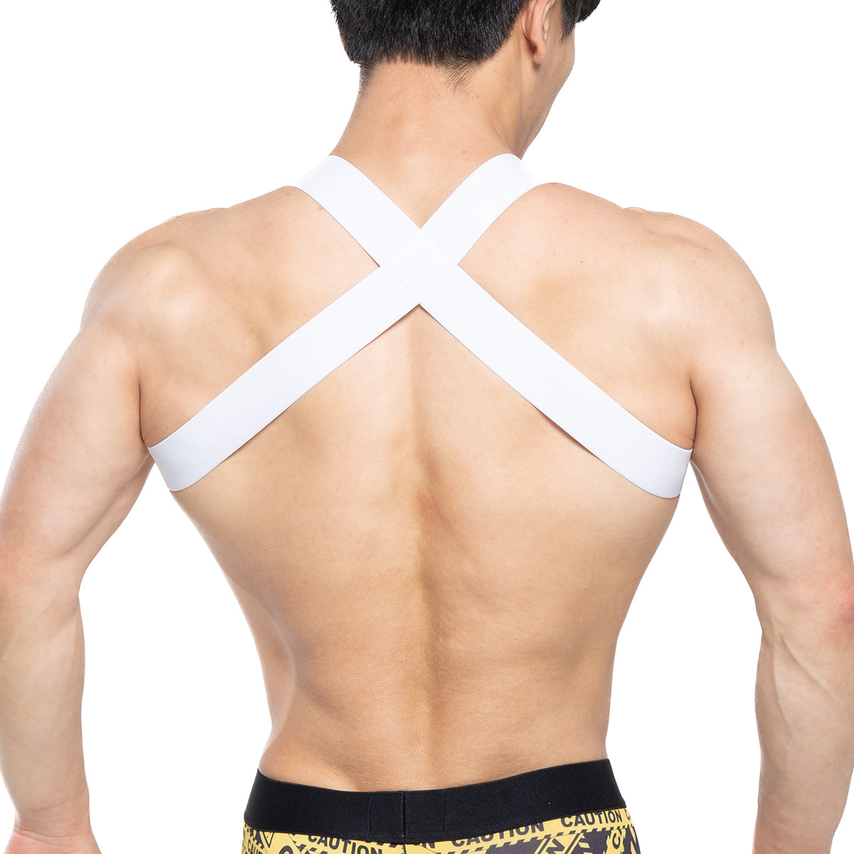 White cross-back athletic support strap worn over shoulders showing back side of metromalewear warning harness 1400-62