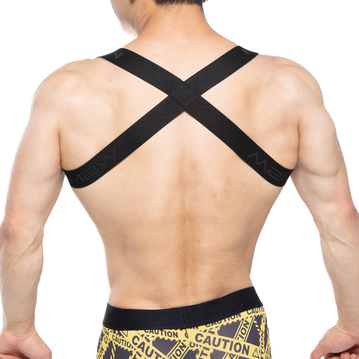 MetroMalewear tank top harness black showing back side with black cross-back support strap and m2 branding