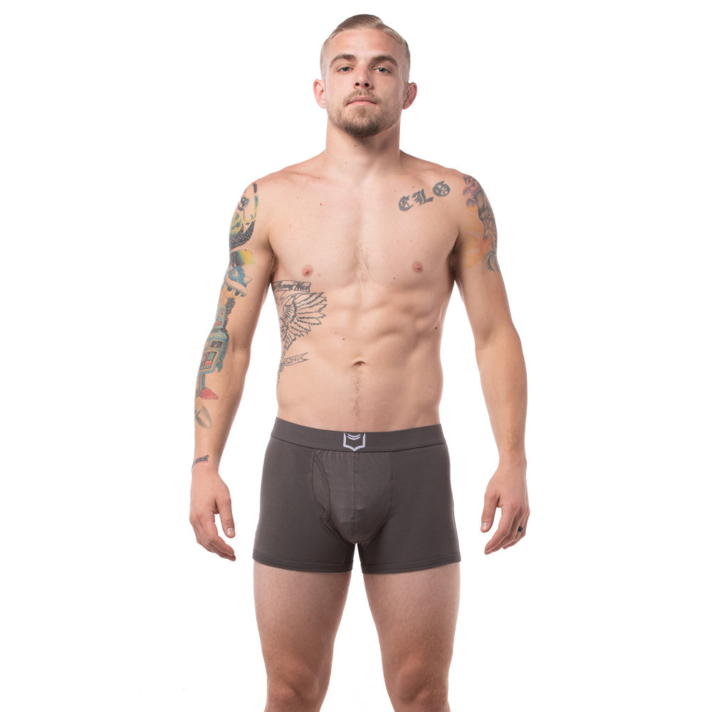 Dark gray men’s sheath 2.1 dual pouch boxer briefs with a subtle white logo on the waistband in a 3 pack bundle
