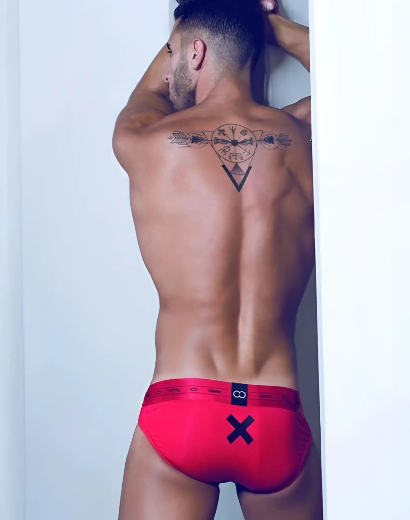 Red men’s 2EROS x series briefs with black x and infinity logo on waistband in size large passion color