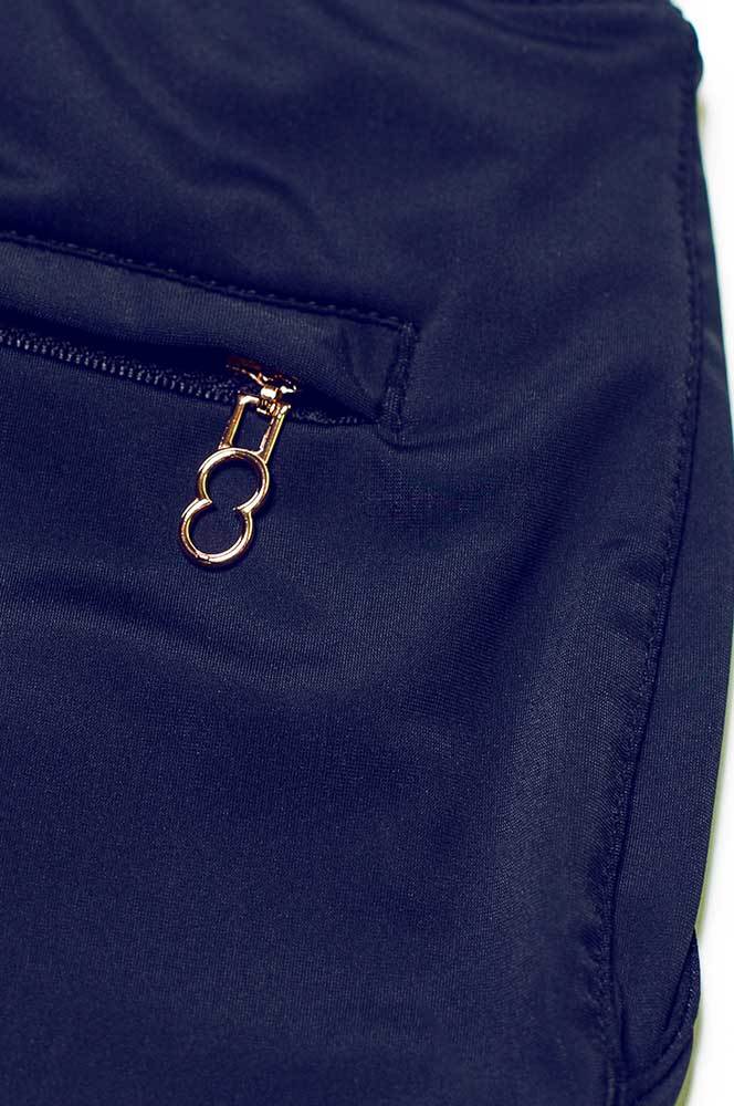 Navy blue bondi short made of nylon featuring a gold-toned zipper pull with an oval ring design