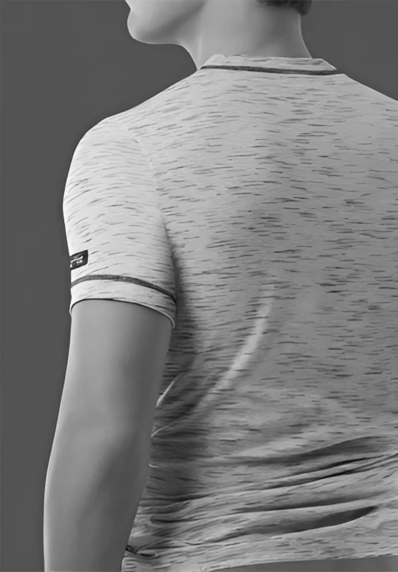 A heather gray 2xist static deep v neck t shirt with subtle striped trim on neckline and sleeve cuffs in size L