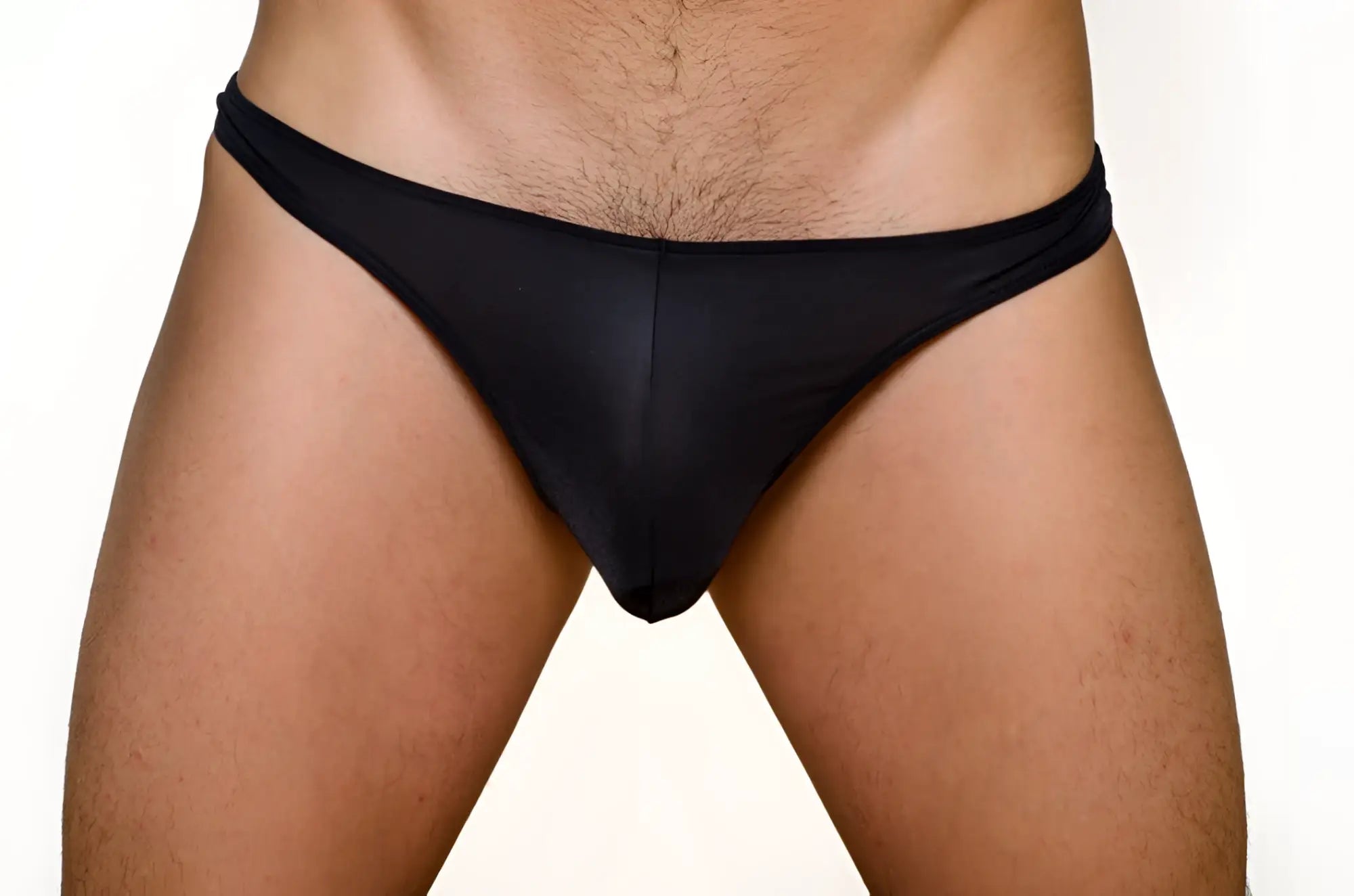 Black form-fitting thong made of smooth stretchy fabric shown from the back in a 3 pack pride metro thong set