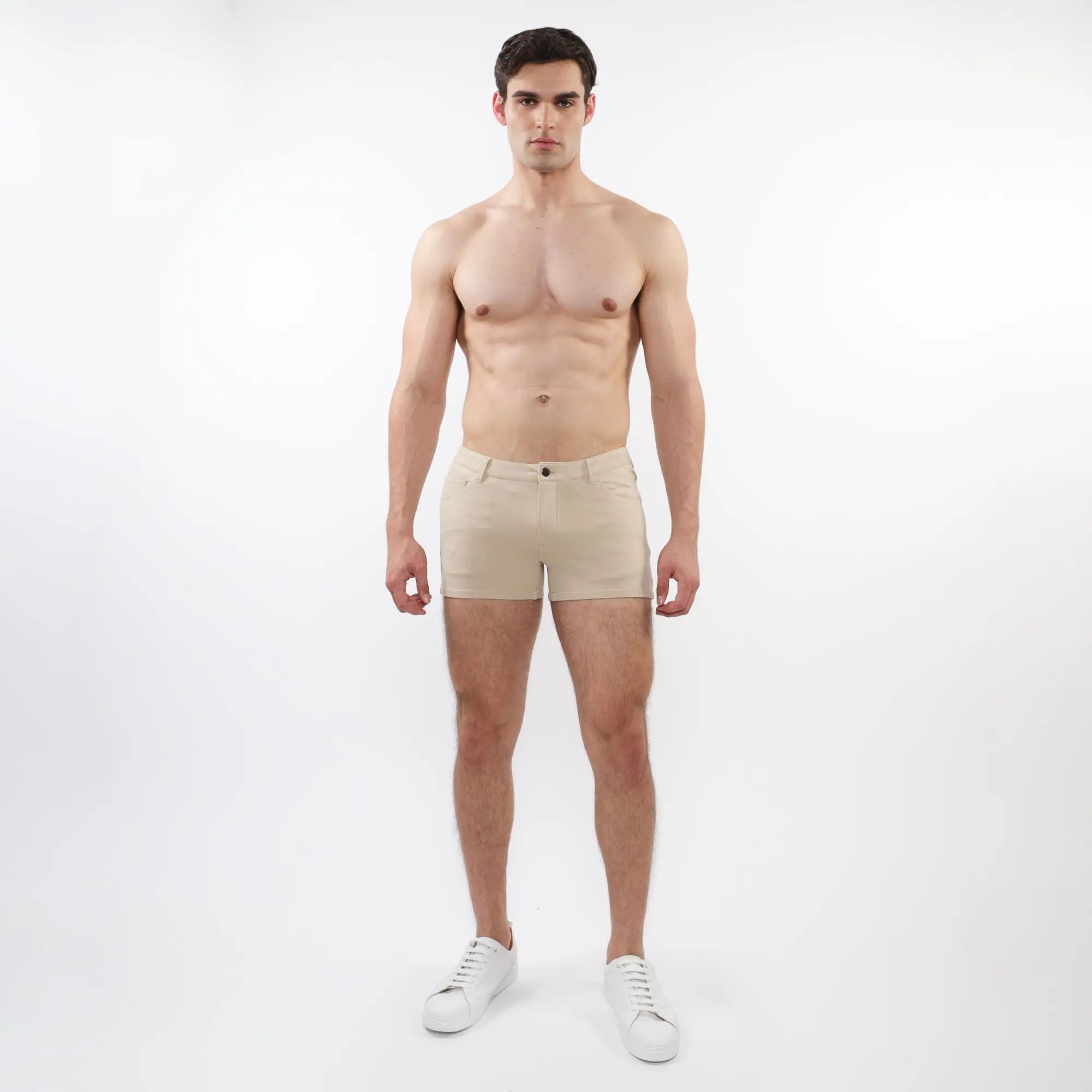 Beige 3 inch stretch knit chino shorts with classic button closure and tailored fit for comfortable wear