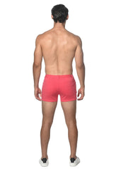 Bright pink 3 inch stretch knit shorts with a modern design and subtle side pockets for athletic wear