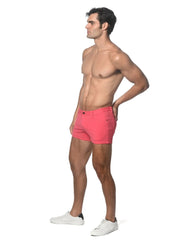 Bright pink 3 inch stretch knit shorts with classic five-pocket design and button closure