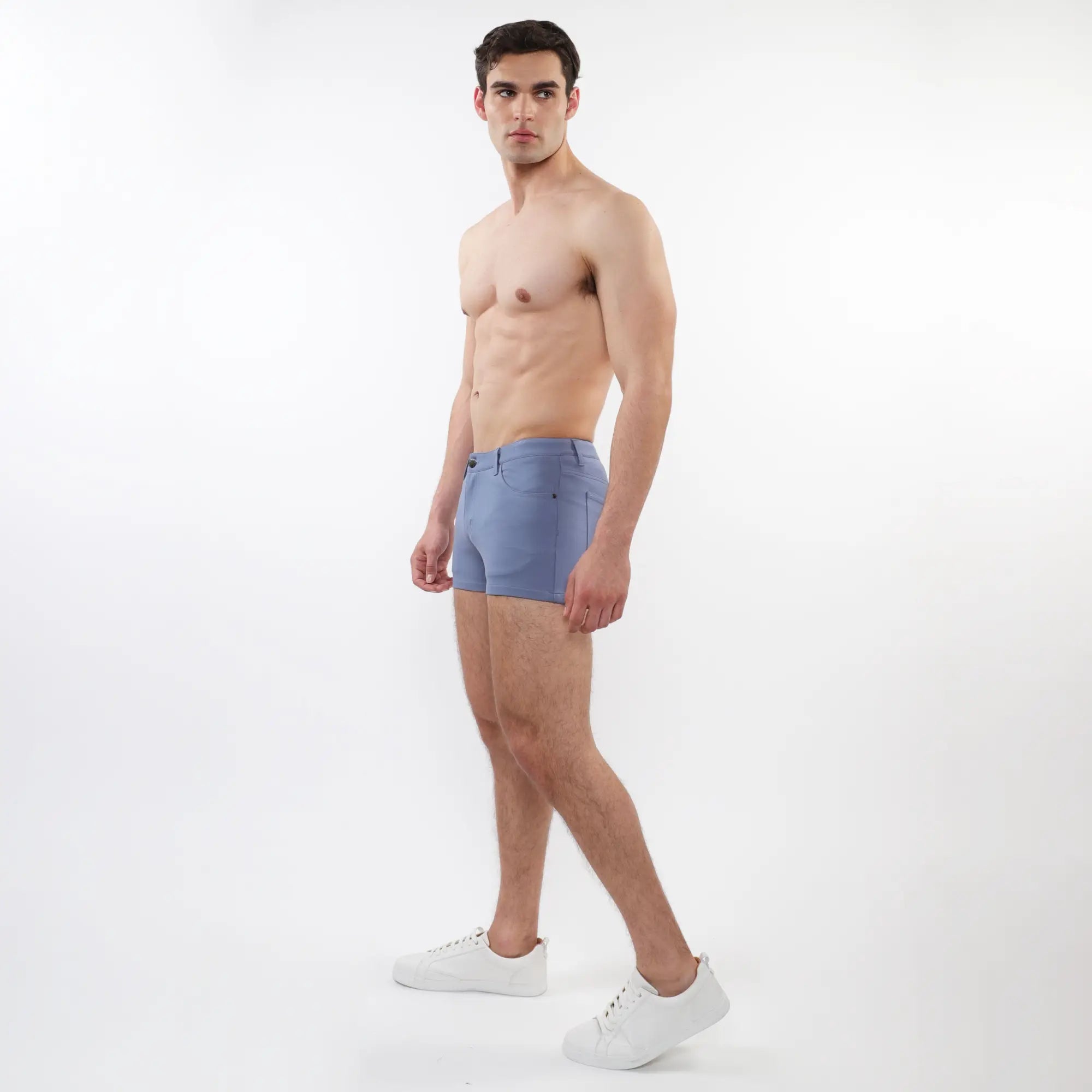 A pair of light blue 3 inch stretch knit men’s shorts with a tailored fit and subtle stitching details