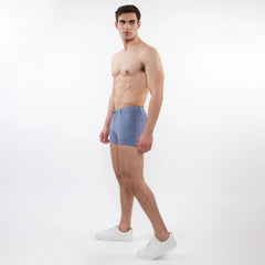 A pair of light blue 3 inch stretch knit men’s shorts with a tailored fit and subtle stitching details