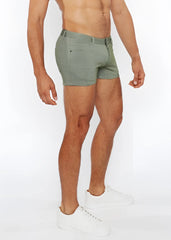 A pair of olive green 3 inch stretch knit two tone shorts with textured fabric belt loop and front pocket