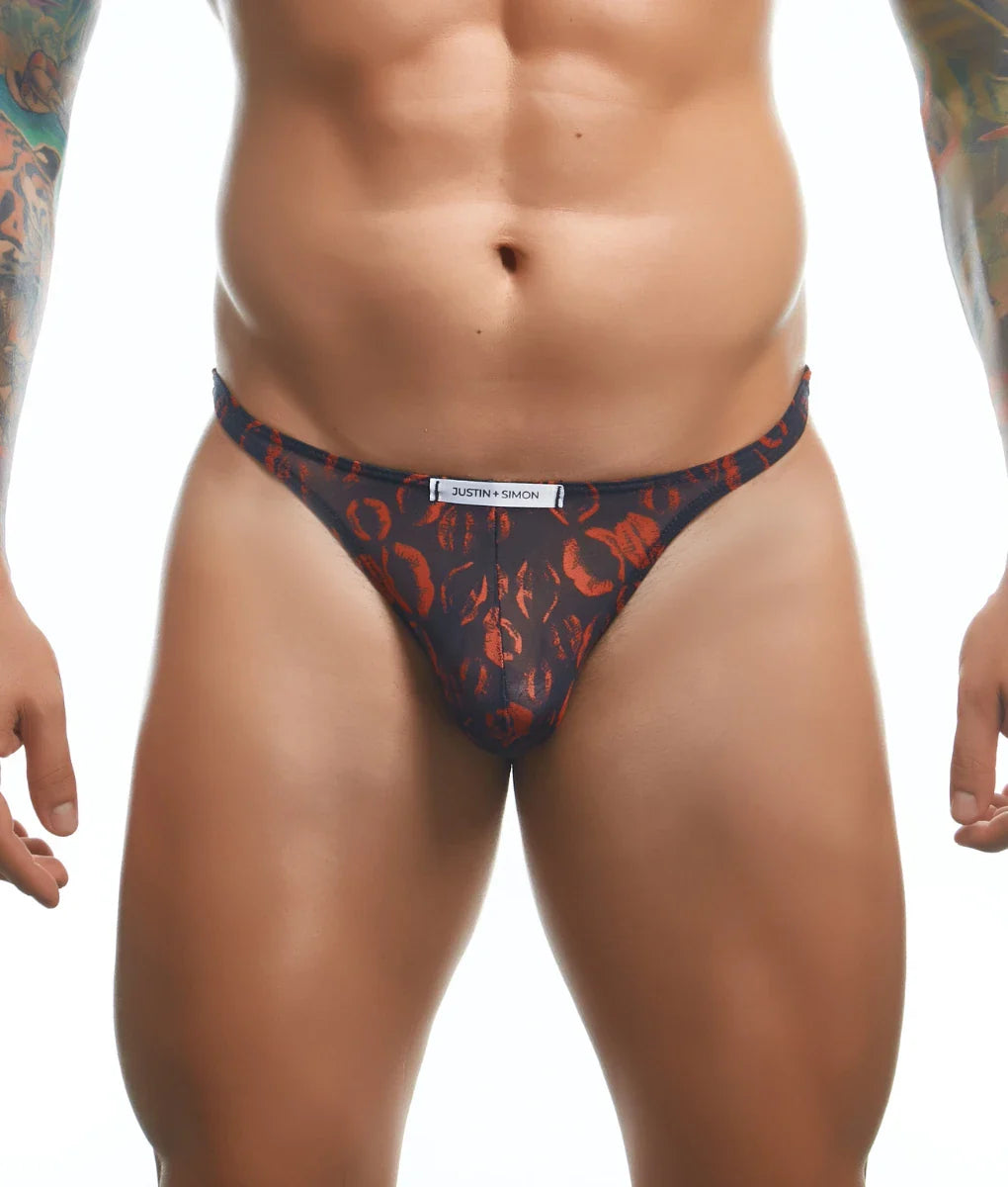 Dark blue classic tanga with bold orange abstract pattern and justin simon brand label on the waistband