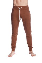 Brown long cuffed jogger and yoga sweat pants with drawstring waist and two front pockets in chocolate brown