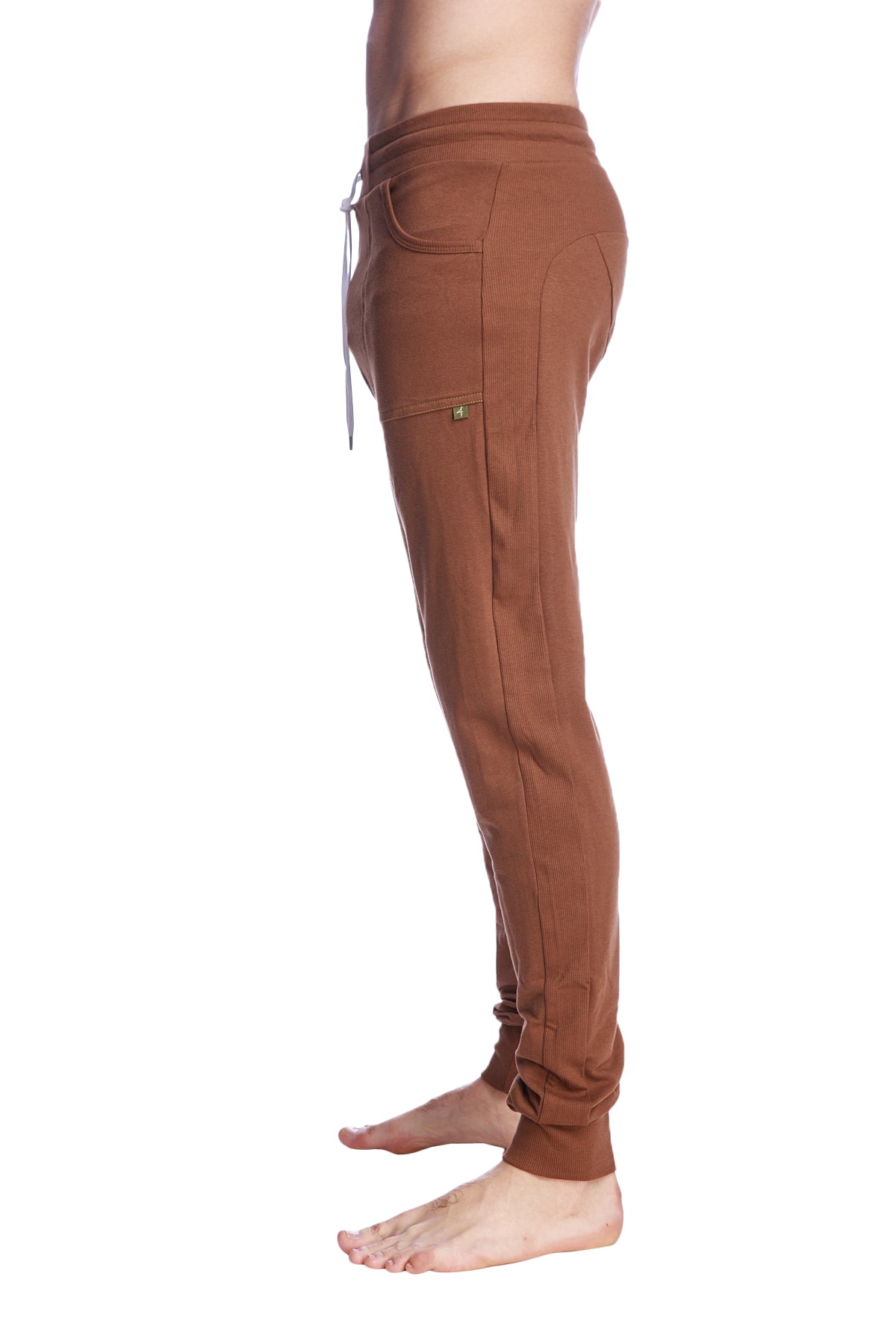 Long cuffed jogger and yoga sweat pants in chocolate brown with drawstring waistband side pockets and soft fabric texture