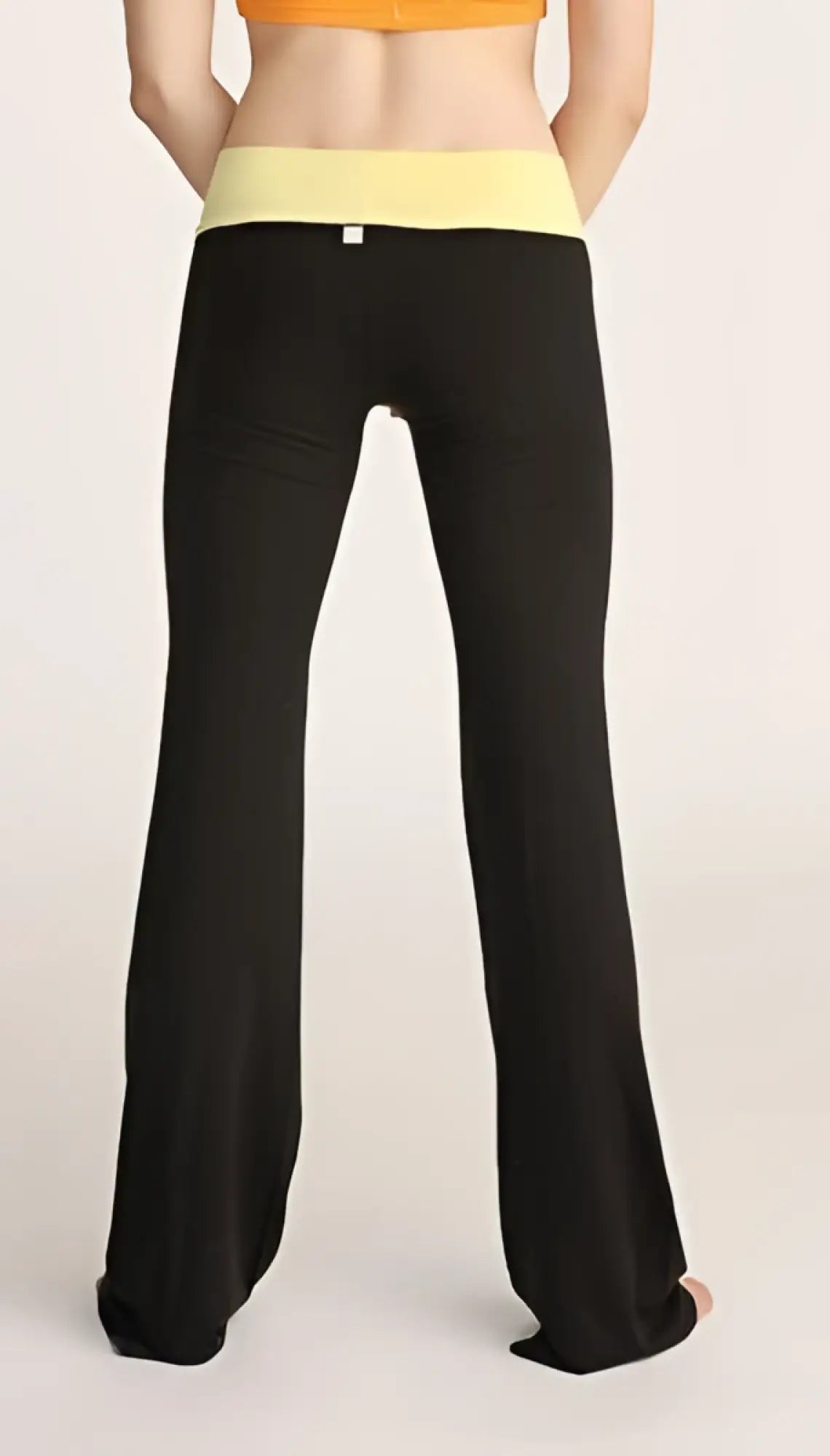 Black flared 4-rth women’s classic yoga pants with a pale yellow waistband designed for comfort and flexibility