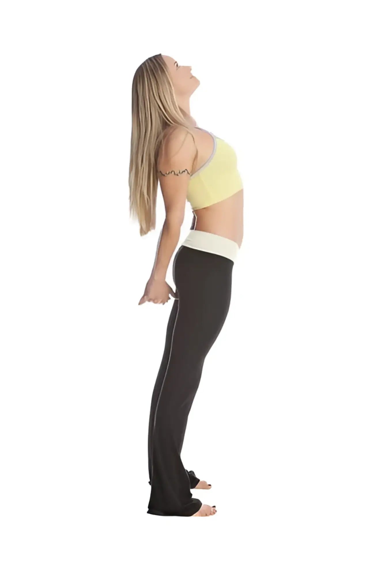 A woman wearing 4-rth women’s classic yoga pant in black with vertical stripe and a light yellow sports bra with white trim