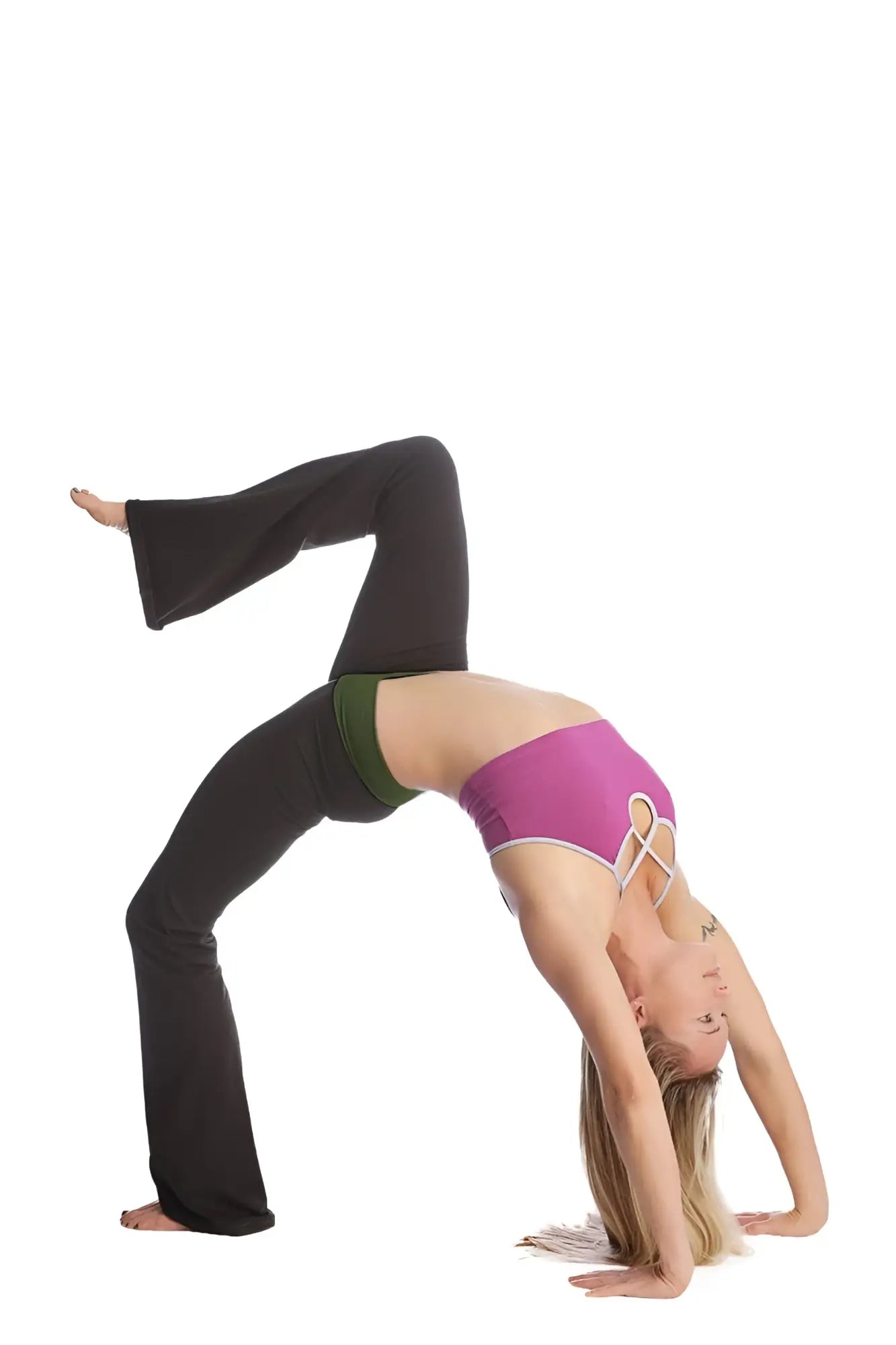 A woman performs an advanced bridge pose wearing 4-rth women’s classic black flared yoga pants and a vibrant purple sports bra