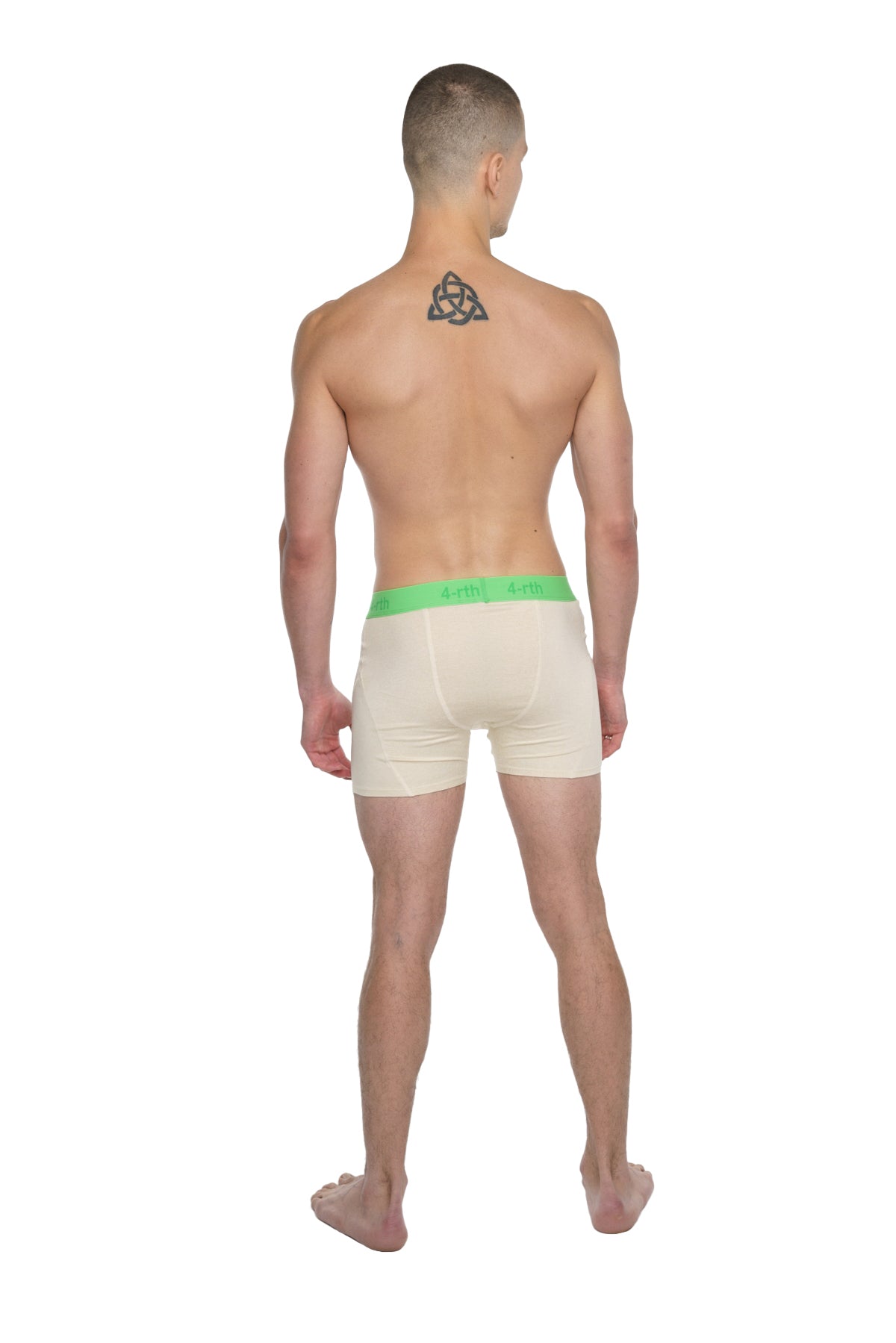 Cream-colored boxer briefs with bright green elastic waistband designed for performance yoga in sand beige tone
