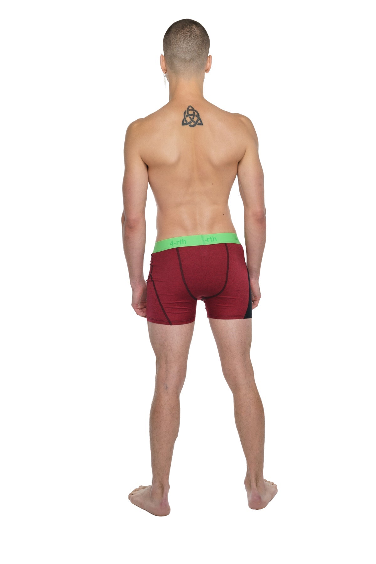 Red athletic briefs with bright green waistband designed for performance yoga and active wear comfort