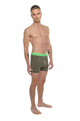 Olive green boxer briefs with bright neon green elastic waistband designed for performance yoga and active wear
