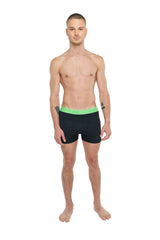 Black boxer briefs with bright green avli waistband designed for performance yoga leggings short in carbon black