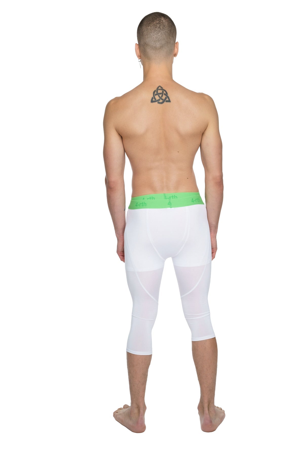 White capri-length performance yoga leggings in arctic white with a bright green elastic waistband for active wear
