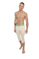 Performance yoga leggings 3/4 in sand beige with cream-colored compression fabric and bright green waistband
