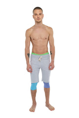 Performance yoga leggings 3/4 lavender heather with light gray shorts, bright green waistband, and blue knee patches