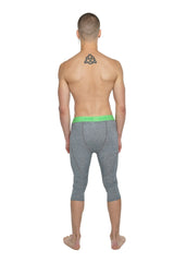Gray heathered steel heather performance yoga leggings with bright green waistband in 3/4 capri length