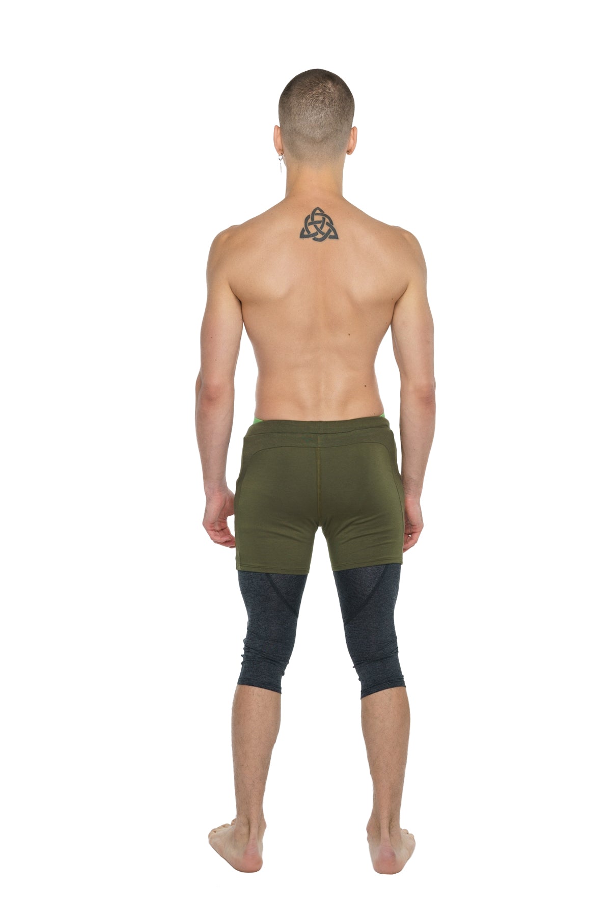 Olive green athletic shorts paired with black 3/4 charcoal heather performance yoga leggings for flexibility and support