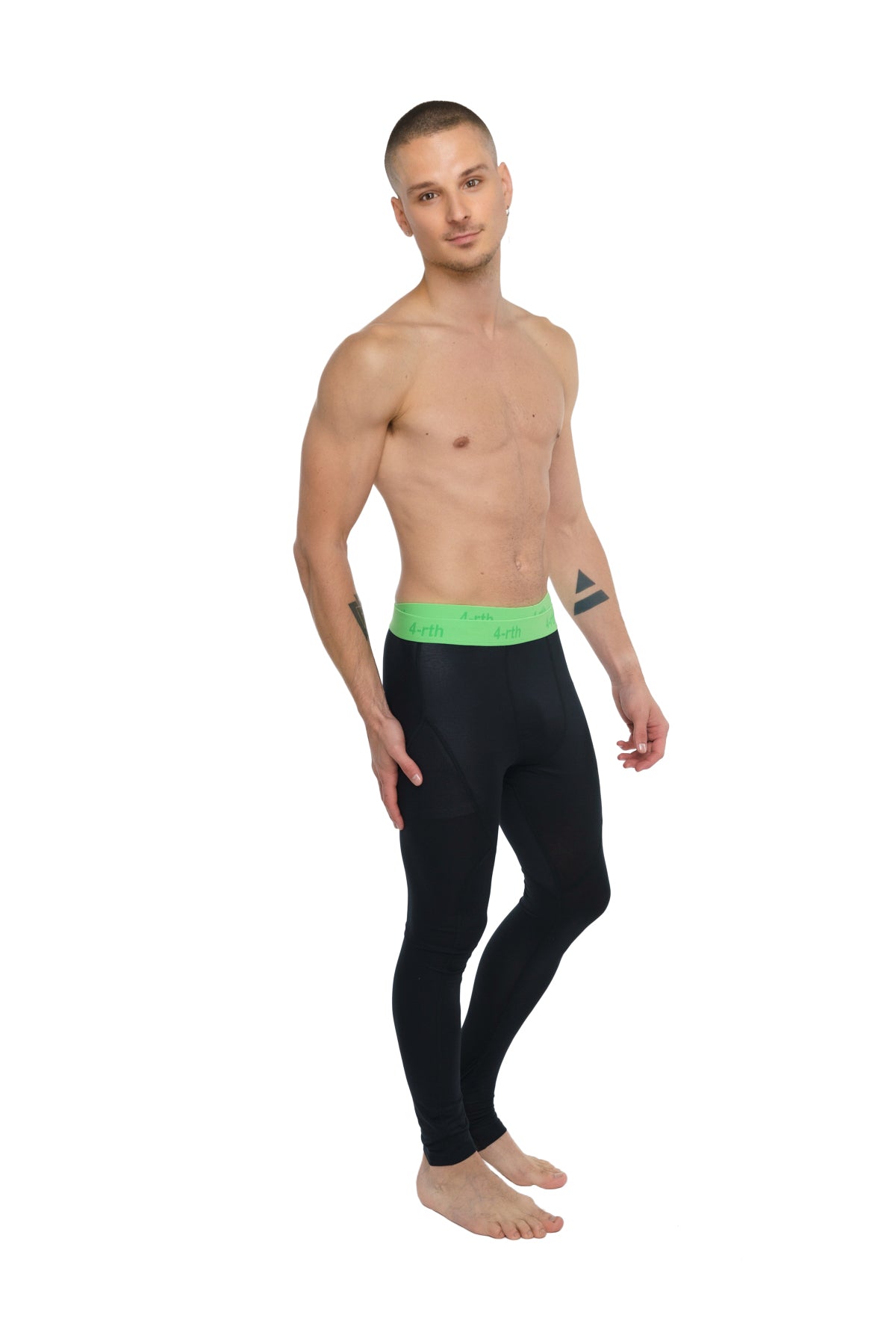 Black performance yoga leggings in carbon black with a bright green Calvin Klein logo waistband long length