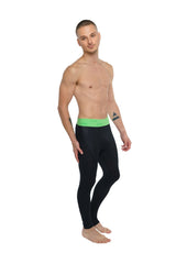 Black performance yoga leggings in carbon black with a bright green Calvin Klein logo waistband long length