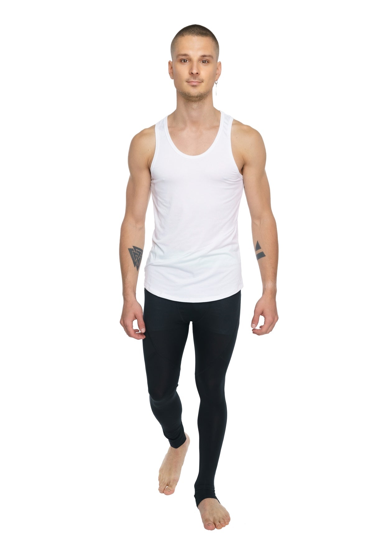 White sleeveless tank top with simple fitted design paired with carbon black performance yoga leggings long fit