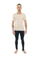A man wearing a sand beige perfect pocket crew-neck tee paired with black form-fitting leggings shows the front side
