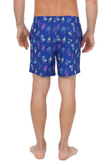Blue 4 way stretch swim shorts with neon pink purple and yellow tropical icons including flamingos and palm trees