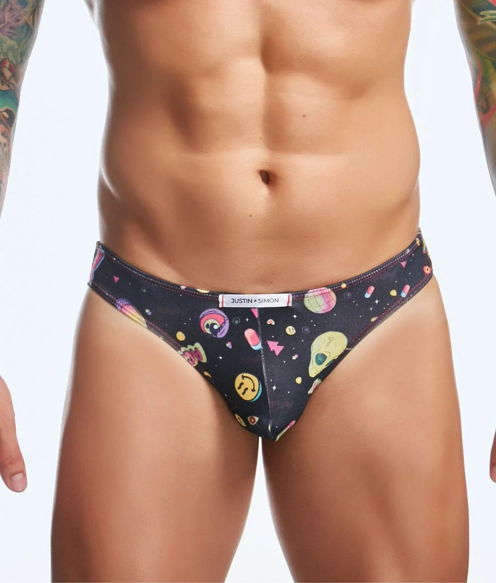 Black briefs by justin + simon featuring a playful space-themed pattern with colorful aliens smiley faces and shapes