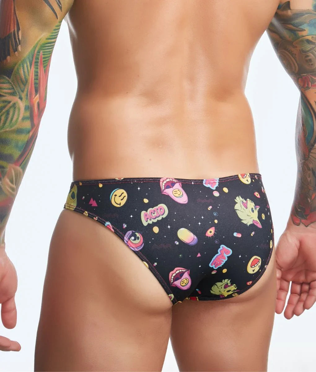 Black swim trunks by Justin + Simon featuring a playful pattern of smiling faces lips and space-themed graphics