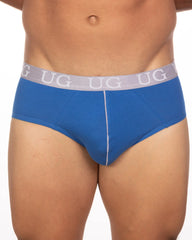 Blue ug men’s briefs with gray waistband featuring white ug lettering and vertical seam from 5-pack undergear basix brief