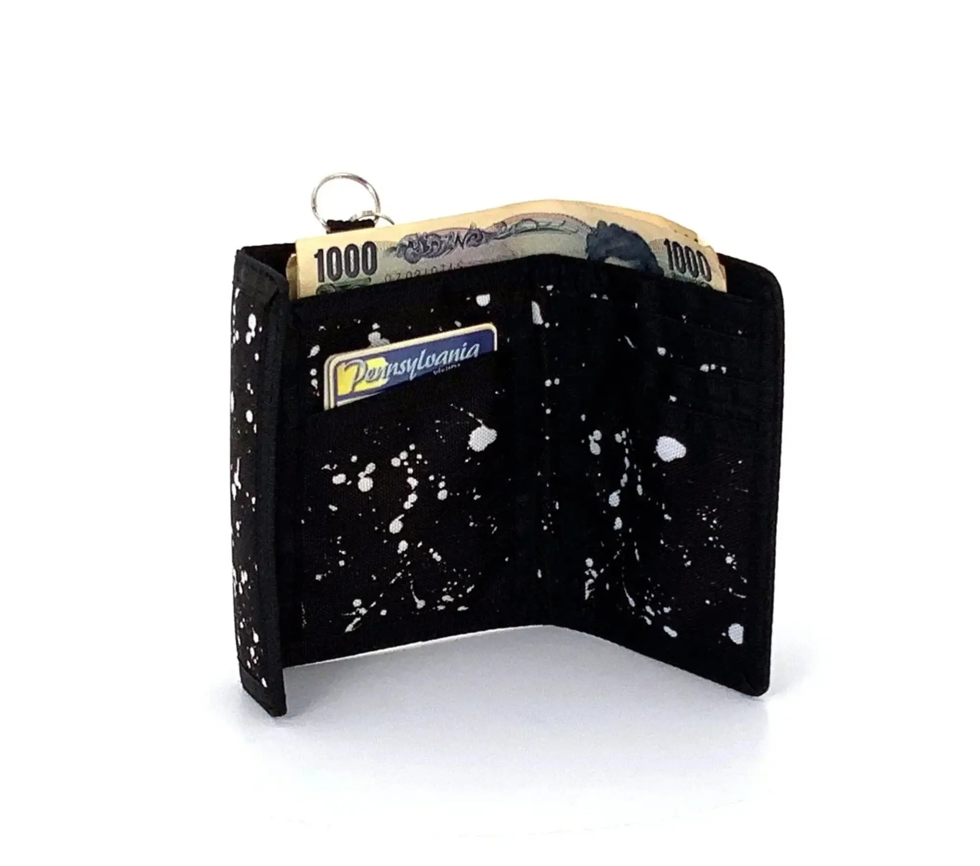 Black 80s velcro wallet with white paint splatter design, silver key ring, and Pennsylvania branded card slot