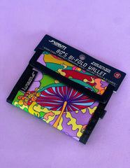 A vibrant 80s velcro bi-fold wallet with psychedelic mushroom and floral fabric design in colorful patterns