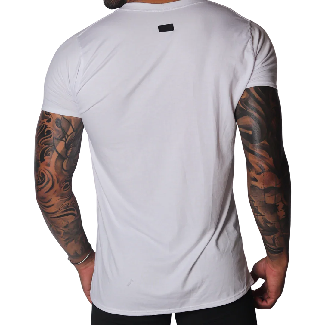 Back view of a plain white crew neck cotton T-shirt featuring a small black rectangular brand logo at the nape.