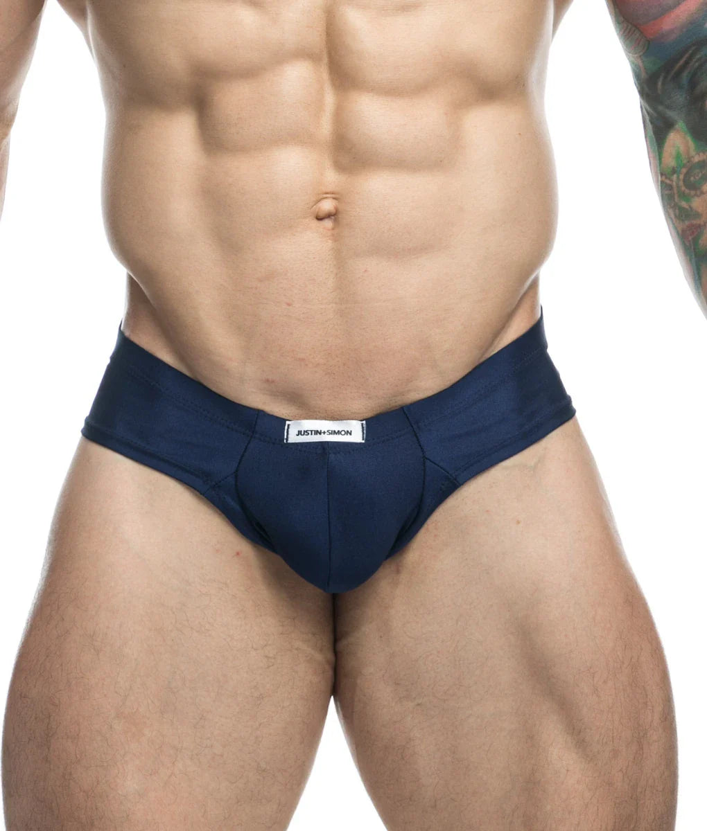 Navy blue justin simon cheek briefs with white waistband label designed for comfortable everyday wear