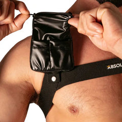 Black synthetic pocket pouch with zipper attached to black elastic harness worn on chest by model branded Absolu Male By TOF Paris