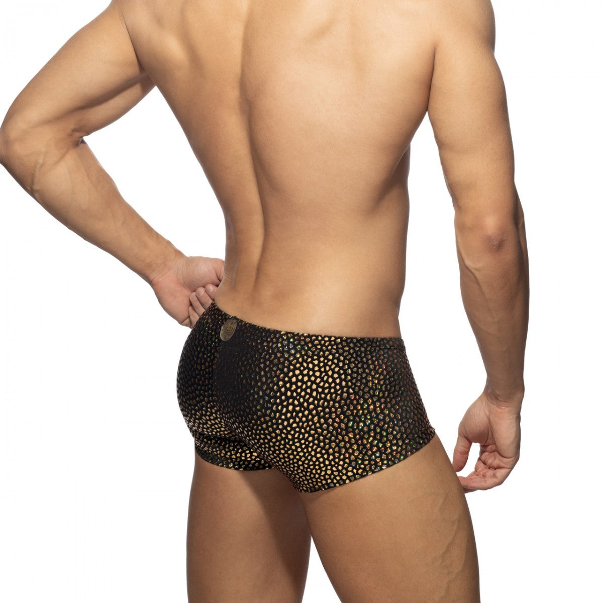 Black swim trunks with shimmering gold dot pattern for stylish beachwear in the gold stones trunk collection
